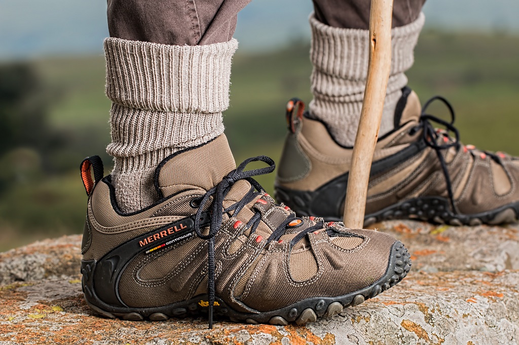 Hiker with pants tucked into socks.