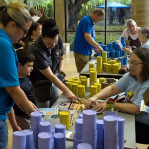 Making colorful bee hotels out of reused cans.
