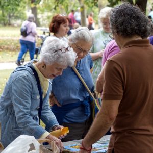 Visitors chat with volunteers about native bees.